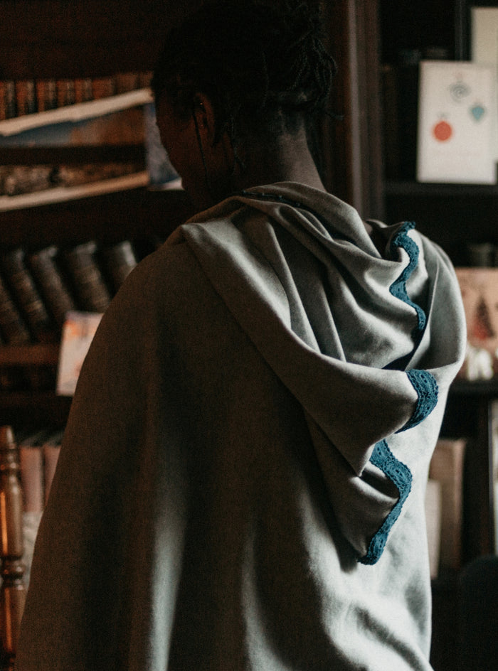 Photo of back view of hood with lace trim.