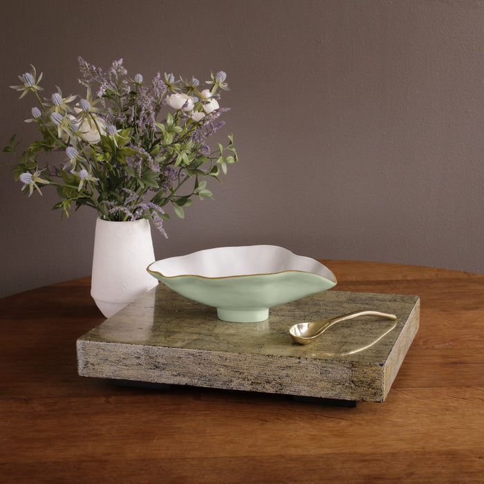 Beatriz Ball Encanto Claire Small Oval Bowl with Spoon — On books beside flowers