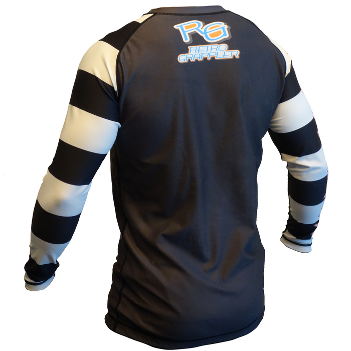 The Its Showtime Beetle Juice Rash Guard by Retro Grappler features black and white striped long sleeves, four-way stretch fabric for comfort, and a blue-orange Retro Grappler logo on the upper back.