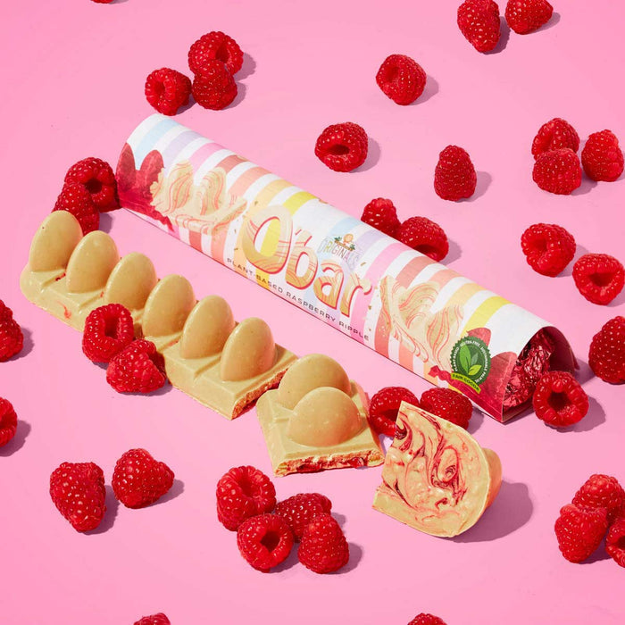 Obar vegan white chocolate raspberry ripple bar with raspberries on a pink background.