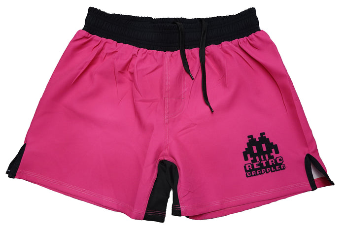 The Pink Retro Lightweight BJJ Shorts by Retro Grappler feature a bright pink design, black waistband, inner lining, drawstrings (no Velcro), and an 8-bit space invader RETRO GRAPPLER logo—perfect for style and comfort on the mats.