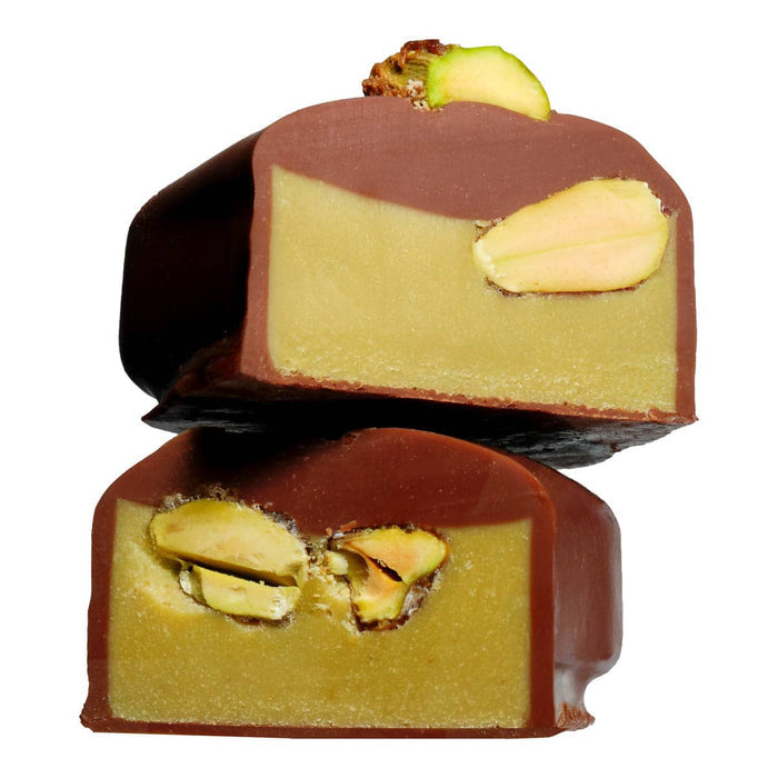 Two chocolate-covered treats with pistachios on a white background.
