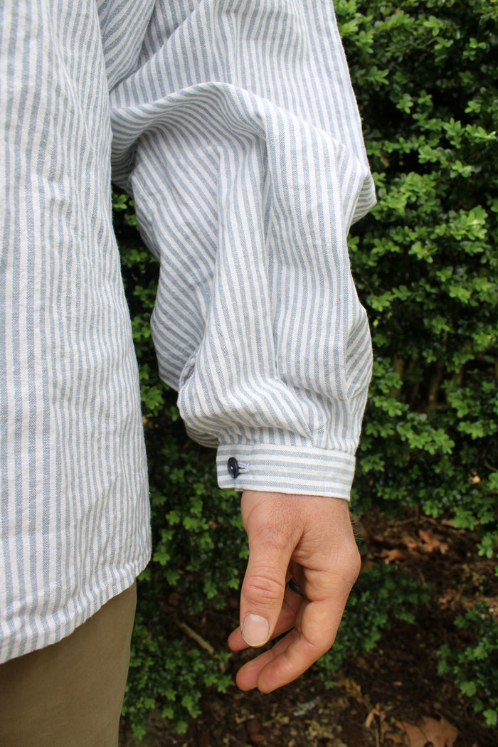 Close-up of a buttoned sleeve.