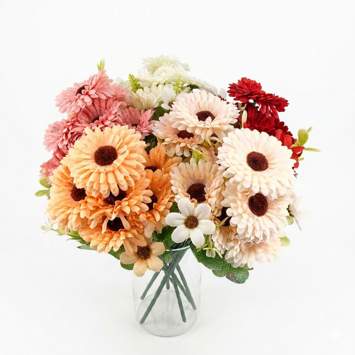 Bouquet of colorful flowers in a clear vase on a white background