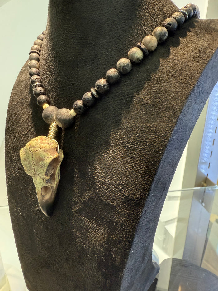 Necklace with stone beads and a decorative element
