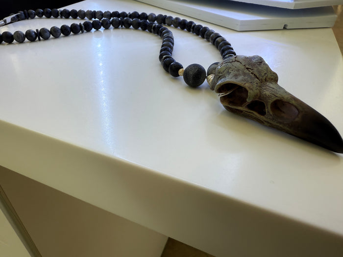 Necklace with black agate beads and a skull pendant