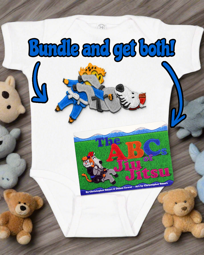 The Retro Grappler ABCs of Jiu Jitsu New Parent Bundle includes a cute white onesie featuring a cartoon lion and dog doing jiu jitsu, plus the colorful ABCs of Jiu Jitsu board book—an adorable baby gift set!.