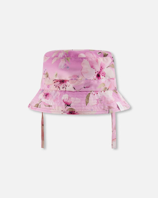Front view of Deux par Deux purple flower print kids sun hat with chin straps