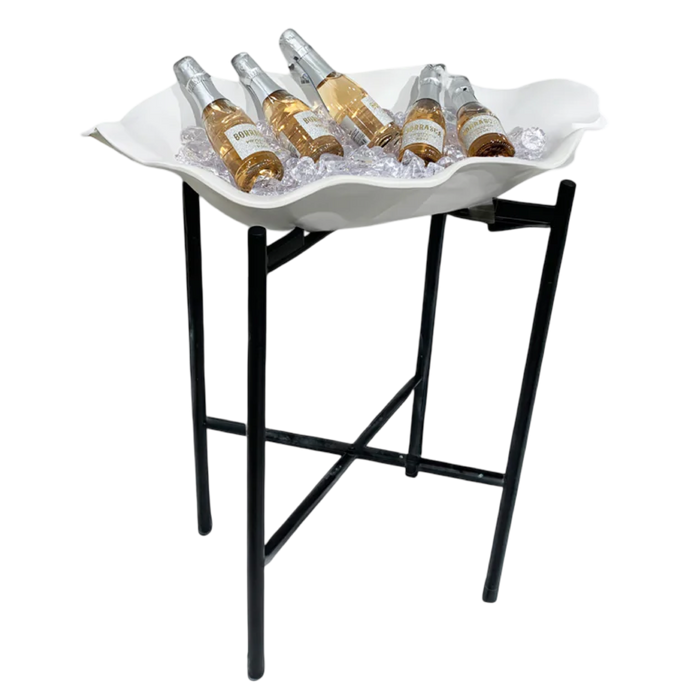 White shell-shaped tray with bottles on a black stand against a white background