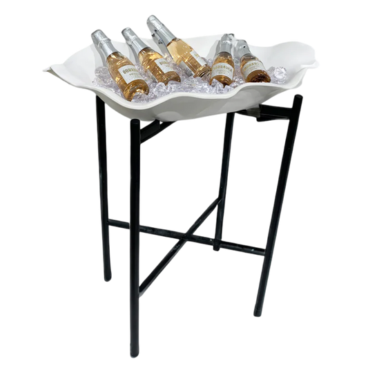White shell-shaped tray with bottles on a black stand against a white background