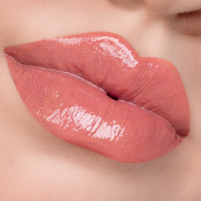 City Girl terracotta nude lip gloss on lips, light skin tone close-up