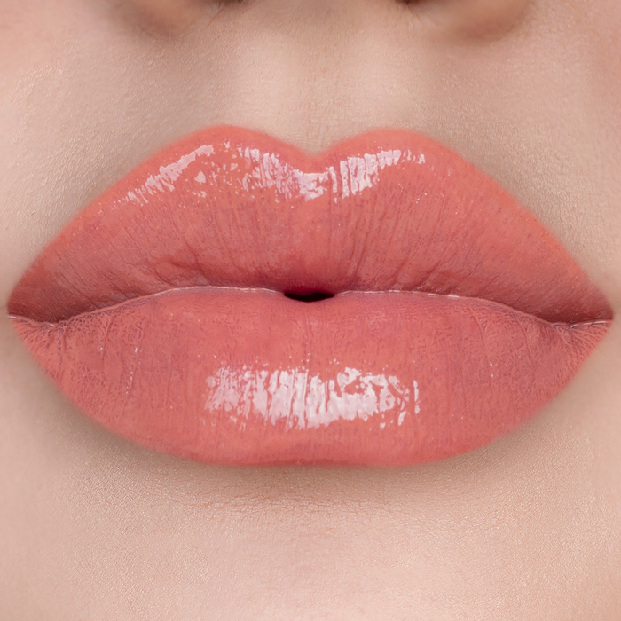 City Girl terracotta nude lip gloss on lips, light skin tone