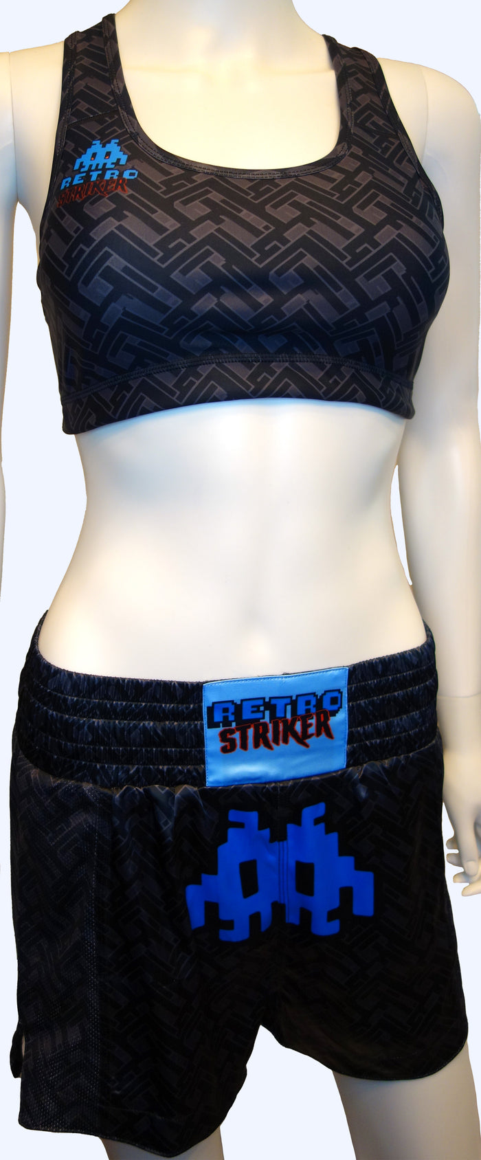 Dark Labyrinth Muay Thai Shorts by Retro Grappler on a Clothes Dummy