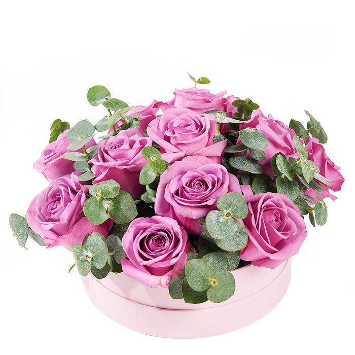 Deluxe Purple Roses and Eucalyptus Flower Arrangement in Pink Hat Box – gift basket with this arrangement includes purple roses and eucalyptus in