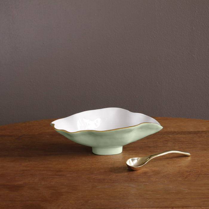 Beatriz Ball Encanto Claire Small Oval Bowl with Spoon — Single bowl and spoon on a wooden surface
