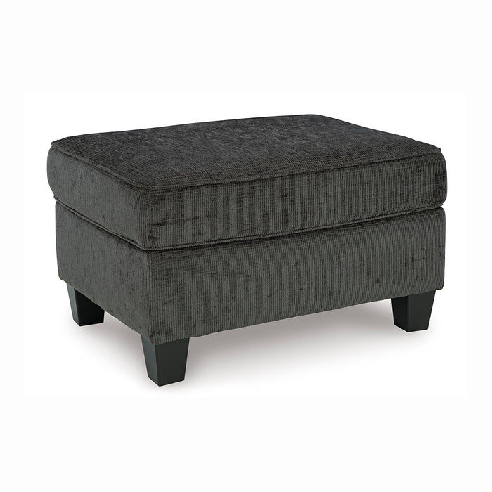 Erinslane ottoman in charcoal gray with earthy tones, angled view, from Signature Design by Ashley