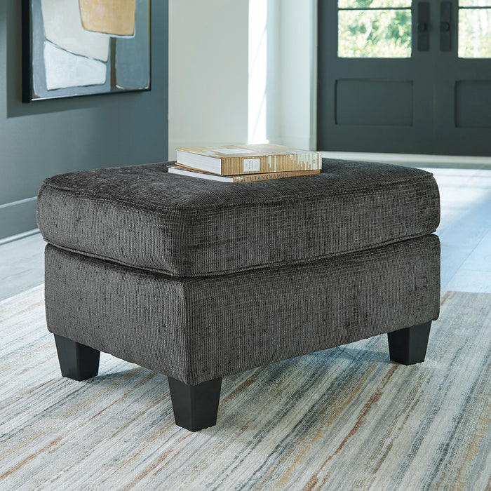Erinslane ottoman in charcoal gray, three-quarter front view, from Signature Design by Ashley
