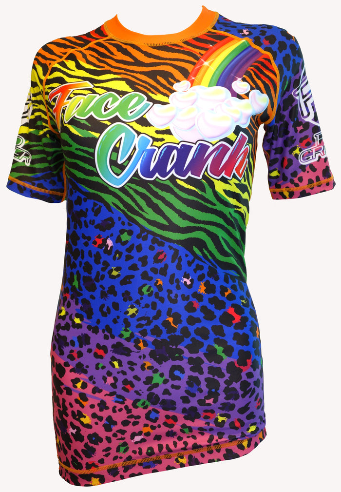 The Retro Grappler Face Crank 2 Lisa Frank Parody BJJ rash guard features bold rainbow animal prints, clouds, and Face Crank across the chest in vibrant colors.