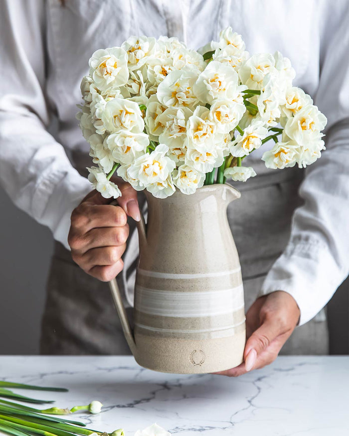 Farmhouse Yellowware Stoneware Pitcher — pitcher filled with white flowers; Farmhouse Pottery