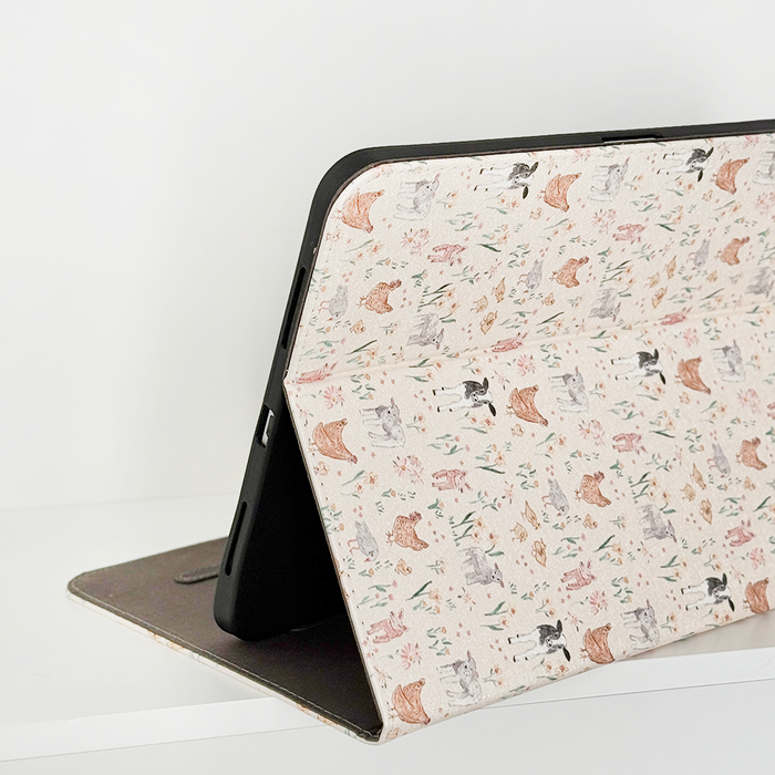 Coconut Lane iPad case with illustrated cats and flowers on a light stand cover.