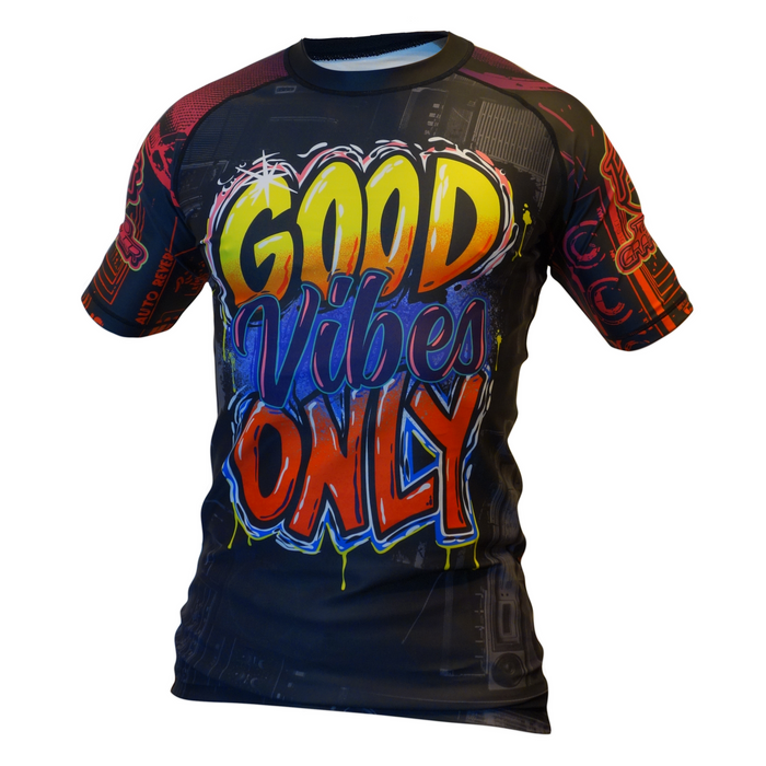 The Retro Grappler Good Vibes Only BJJ Rash Guard features short sleeves, a black base, bold graffiti-style GOOD Vibes ONLY text in yellow, orange, and blue on the front, plus artistic graphics on the sleeves and background.