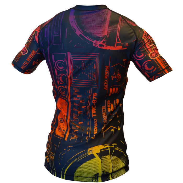 The Good Vibes Only BJJ Rash Guard by Retro Grappler features a vibrant, multicolored print of vintage audio gear, adding retro flair and unique style to your grappling attire.