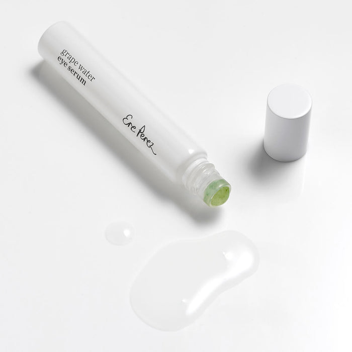 8ml Ere Perez Grape Water Eye Serum with a jade roller applicator. Clear serum to brighten eye area.