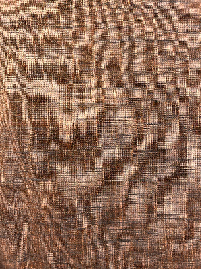 Handloom cotton fabric in a rich brown color.