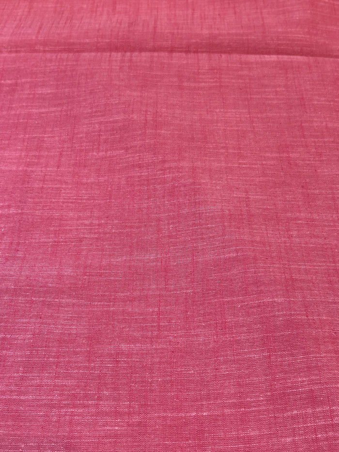 Handloom cotton fabric in a red color.