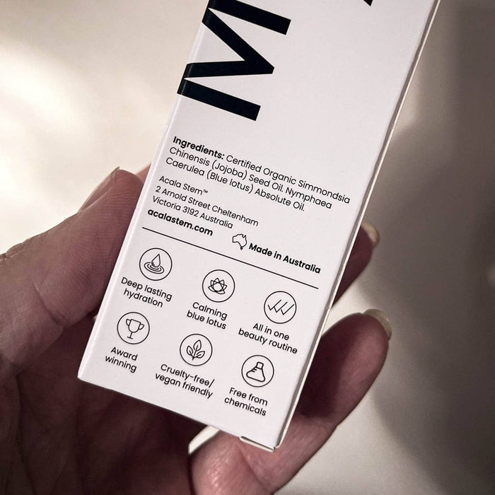 Close up of a hand holding the box packaging with ingredients shown. Made in Australia.