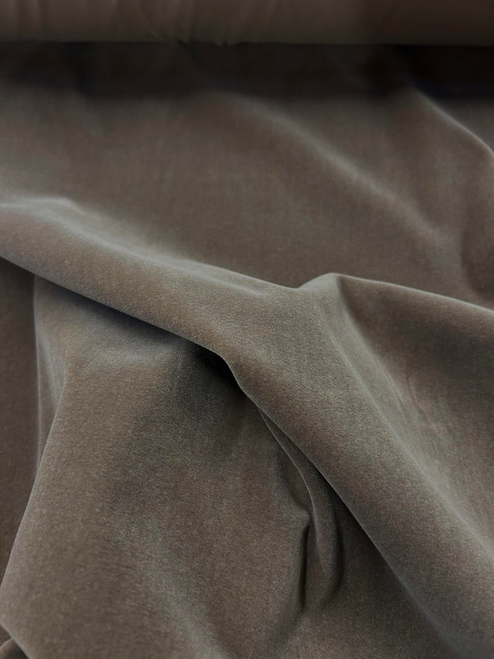 Close up of a draped mocha brown velvet.