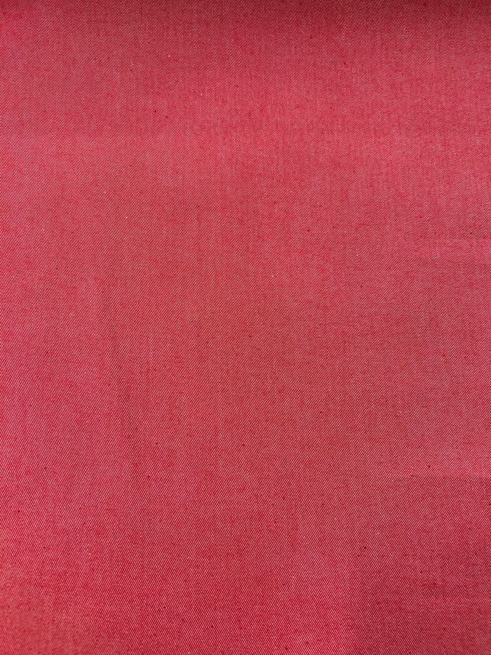 Bright red cotton denim fabric.