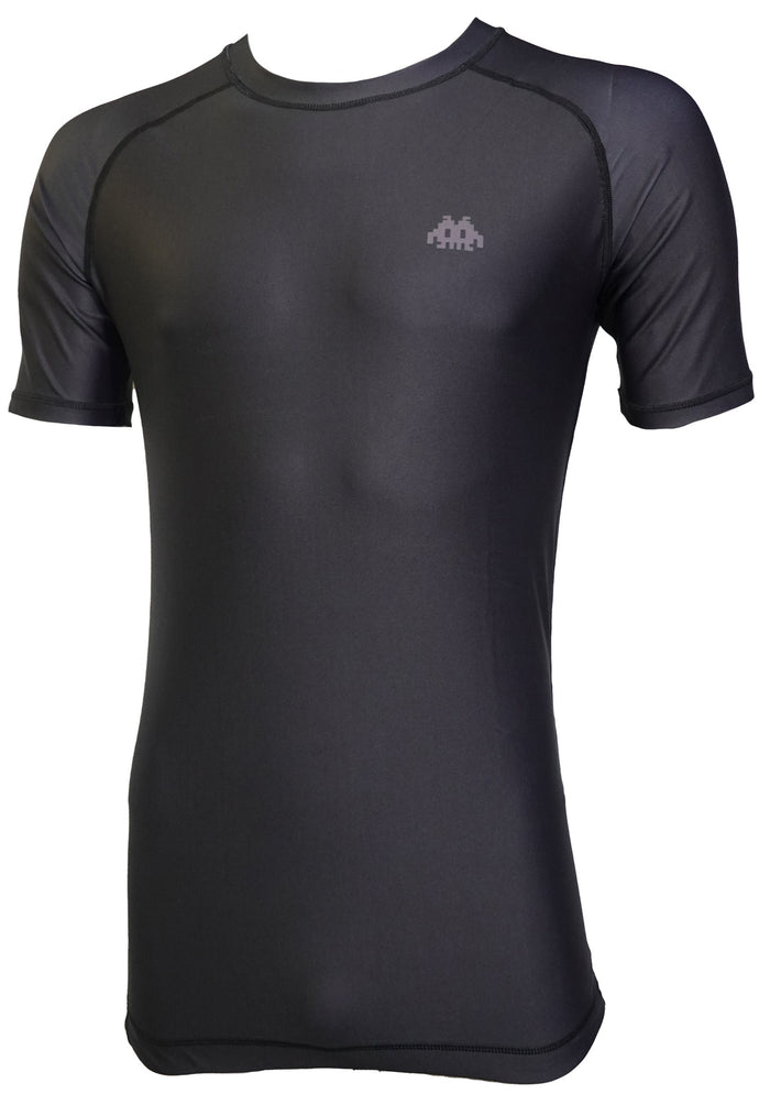 The Retro Grappler Just a black rash guard for Jiu Jitsu and MMA is a fitted, short-sleeve black shirt with a small light gray logo and Grappler Gripper technology, shown on a mannequin against a white background.
