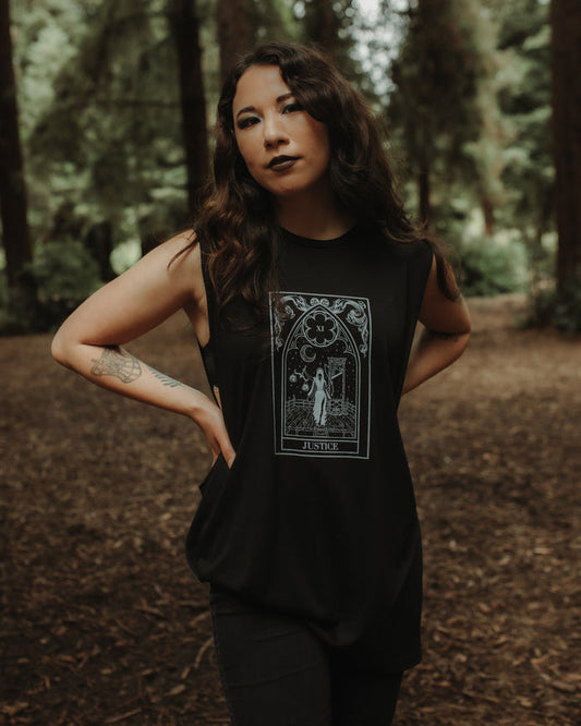Justice graphic tank worn by model, relaxed-fit black cotton tank top