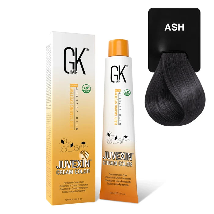 GK Hair Juvexin Cream Color Mixtones Ash carton and 100 ml tube beside a cool charcoal blue-black hair swatch