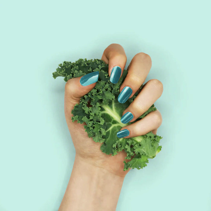 Nails painted with non-toxic, aqua green nail polish with kale protein infusion.
