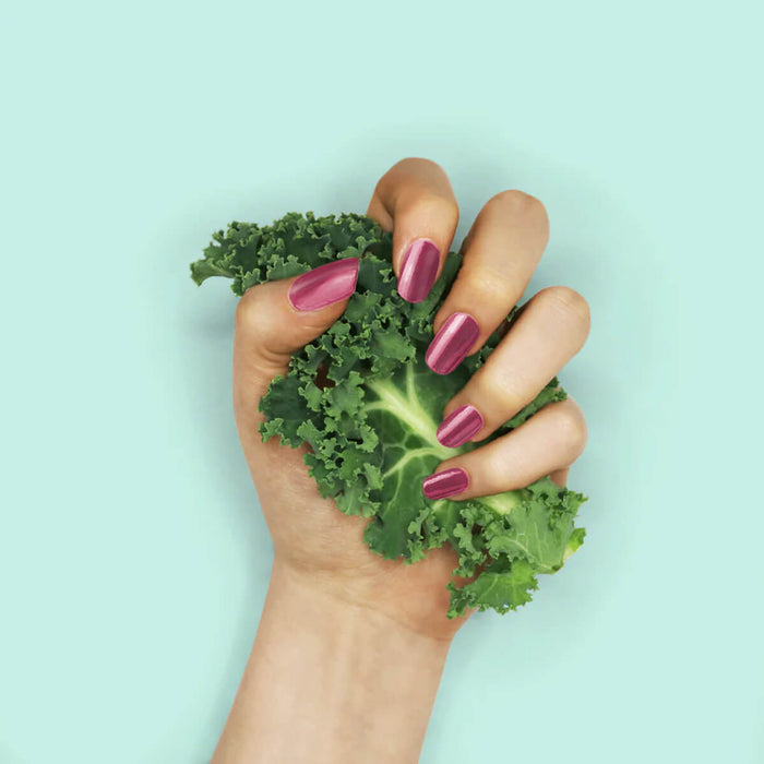 Nails painted with non-toxic, purple shimmer nail polish with kale protein infusion.