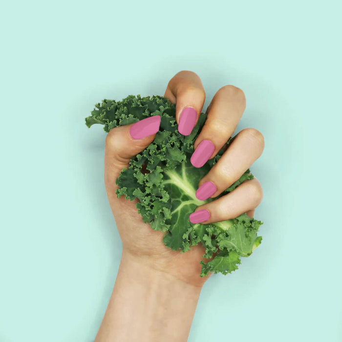 Nails painted with non-toxic, bright candy pink nail polish with kale protein infusion.