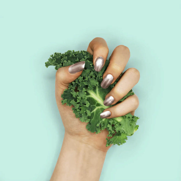 Nails painted with non-toxic, gold shimmer nail polish with kale protein infusion.
