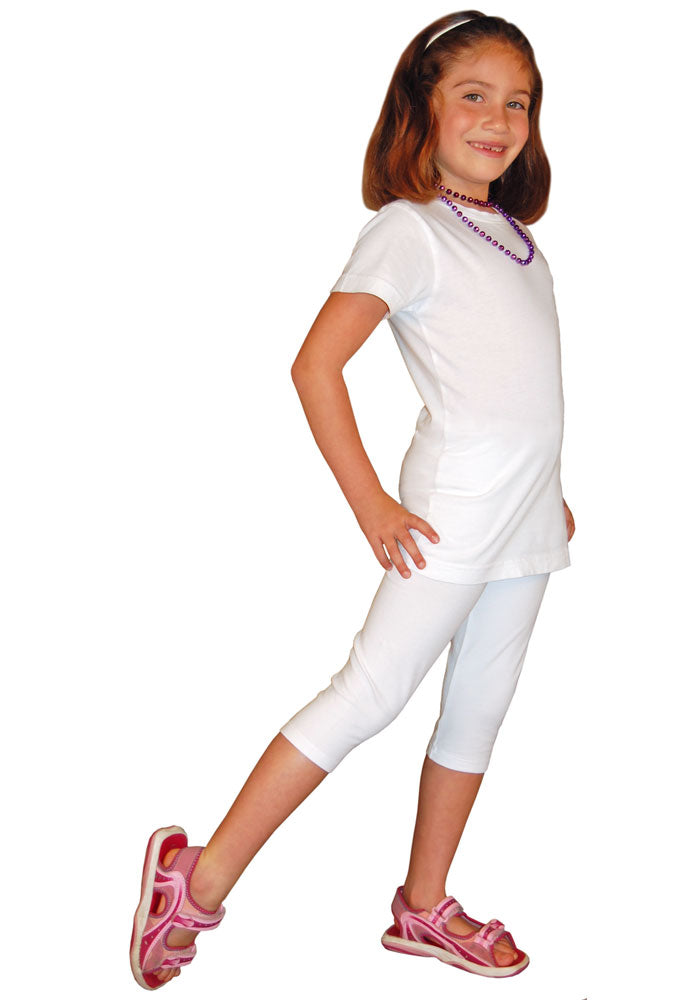 A child wearing white capri-length leggings and a white t-shirt.