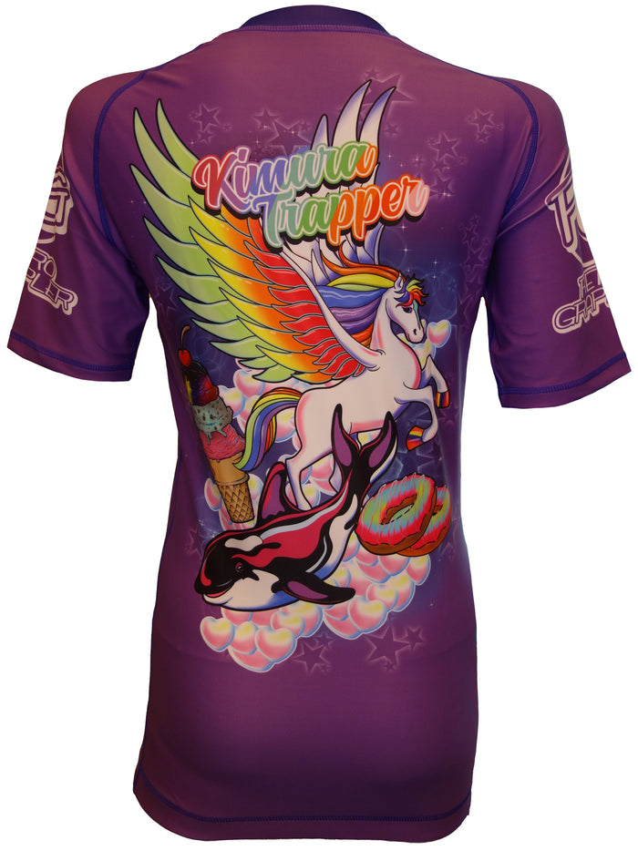 The Retro Grappler Kimura Trapper Purple Pegasus Rash Guard features short sleeves and a vivid winged unicorn, ice cream cone, dolphin, bubbles, and Kimura Trapper design—perfect for standout jiu jitsu style.