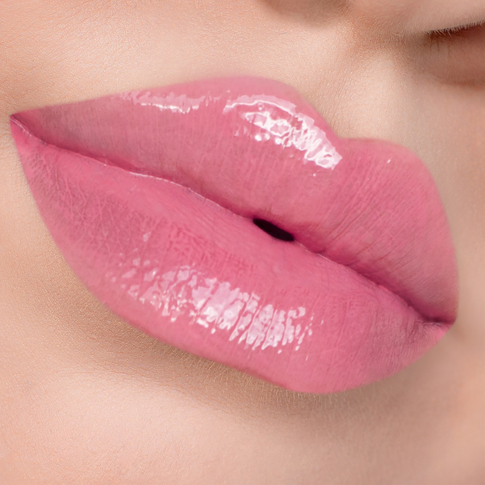 Lip to Lip rosy pink lip gloss on lips, light skin tone close-up
