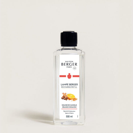 Bottle of Maison Berger lamp refill on a light gray background