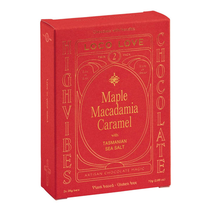 Red packaging of Maple Macadamia Caramel chocolate with gold text on a white background.