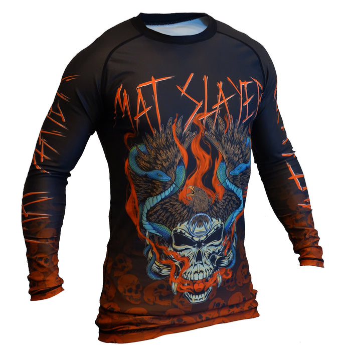 The Mat Slayer BJJ Rash Guard by Retro Grappler is a black and orange long-sleeve top with a winged skull, blue snakes, flames, and MATSLAYER in fiery letters—ideal for MMA or jiu jitsu training.