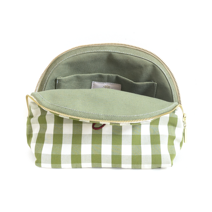 Millie Moss green and white check pouch with open zipper showing green interior pockets and fabric lining