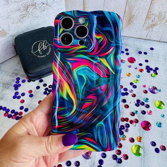 Neon Taffy Wavy Luxe MagSafe Case for iPhone â The fluid marble design features hypnotic swirls and waves in electric neon colors that shift and flow across your phone like melted taffy or liquid art.