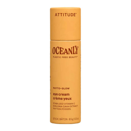Orange eye cream stick with 'Attitude' branding on a white background.