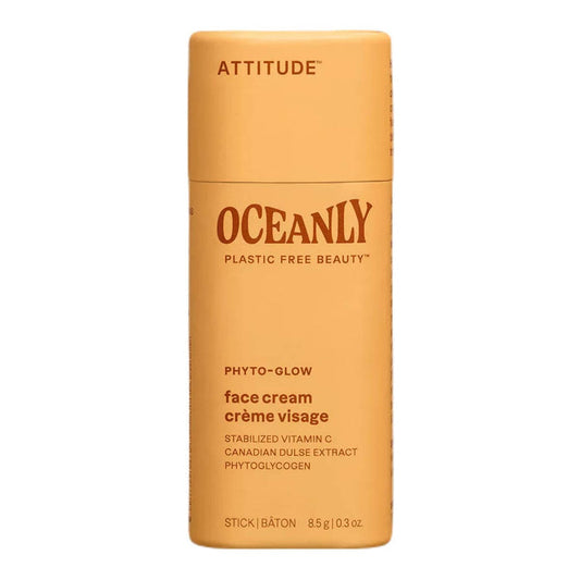 Orange face cream stick with 'Attitude' branding on a white background.