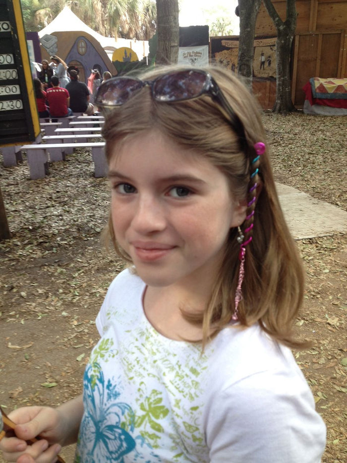 Model wearing Pink Rainbow Hair Twister - 4" Spiral Ponytail Wrap